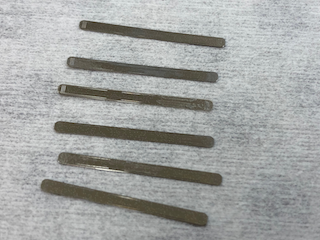 Small Ni nozzle-plates, micropatterned conical spray orifices